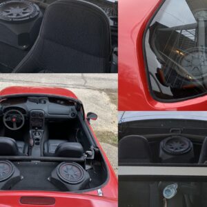 A red car with speakers installed