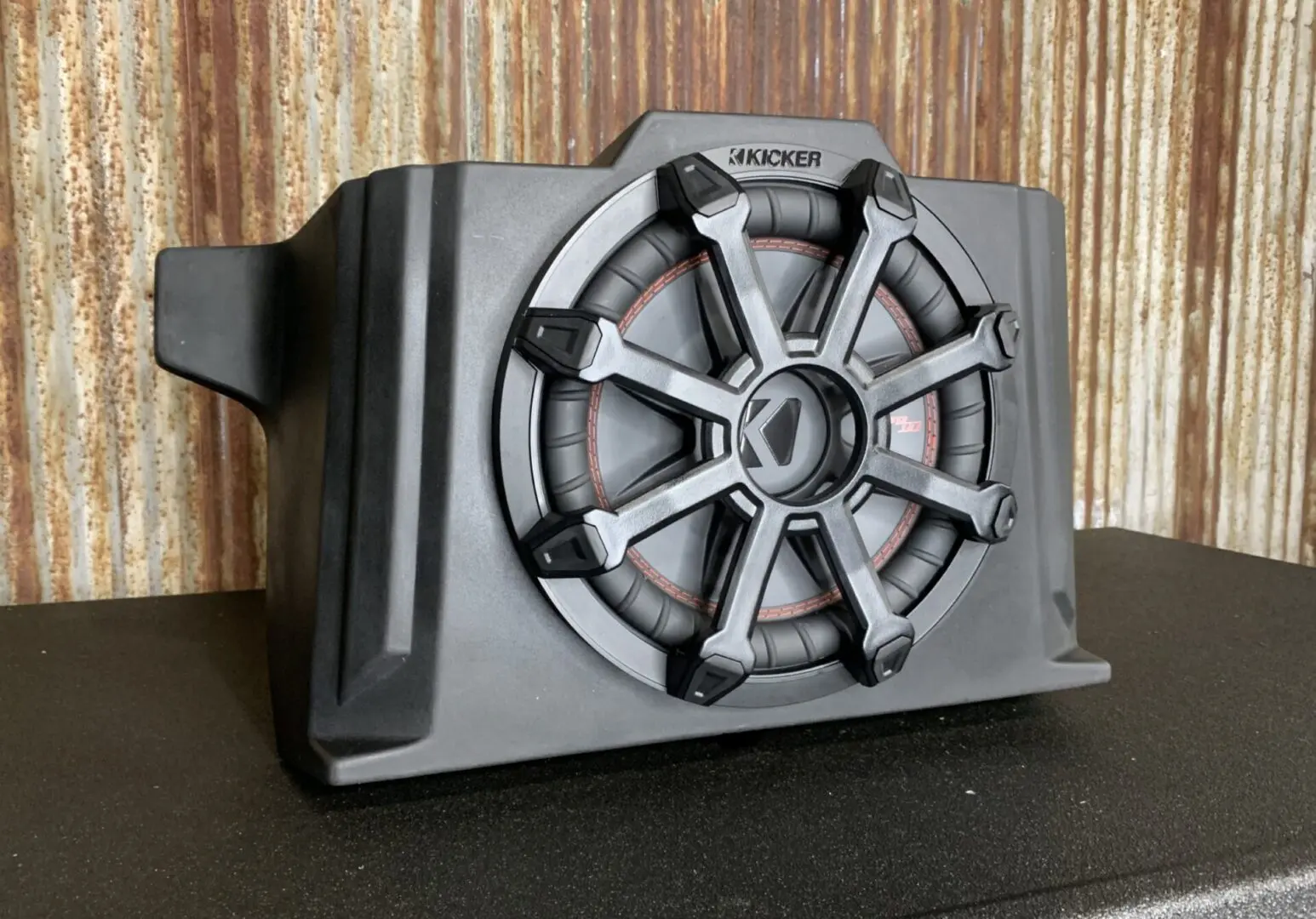 A kicker 8 inch subwoofer on display