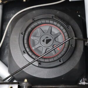 Image of a kicker 10 inch subwoofer installed in car