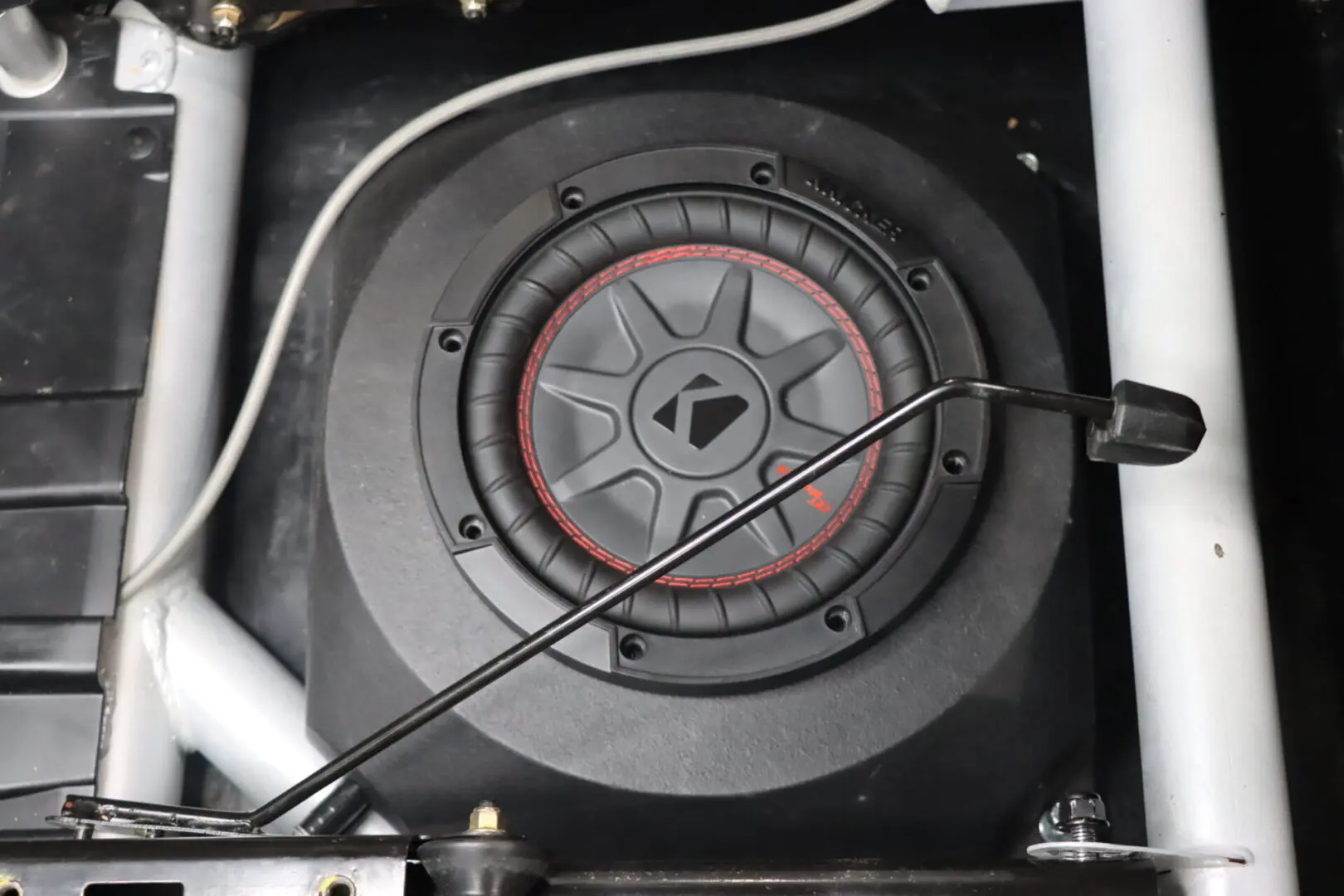 Image of a kicker 10 inch subwoofer installed in car