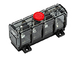 Black plastic fuse block with red cap